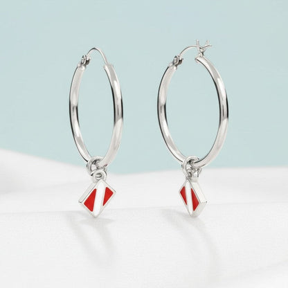 Big Blue by Roland St John sterling silver hoop earrings with red and white dive flag charms.