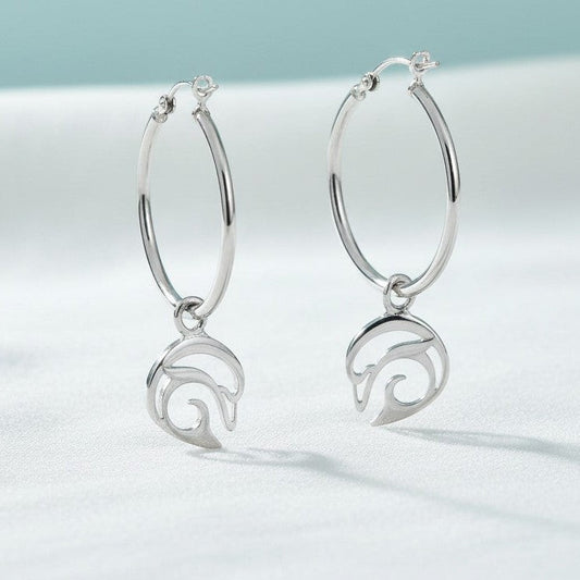 Big Blue by Roland St John sterling silver hoop earrings with playful dolphin charms. Approx. 1.75 inches long.