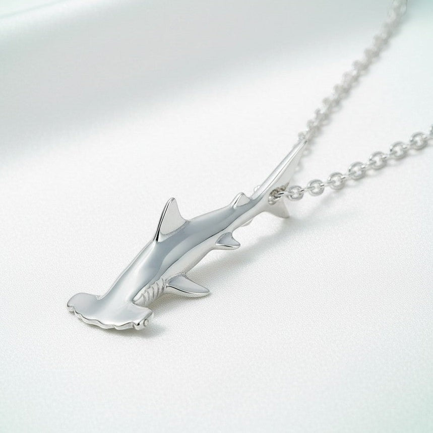 Big Blue by Roland St John sterling silver mini hammerhead shark necklace, detailed 3D pendant on a silver chain.