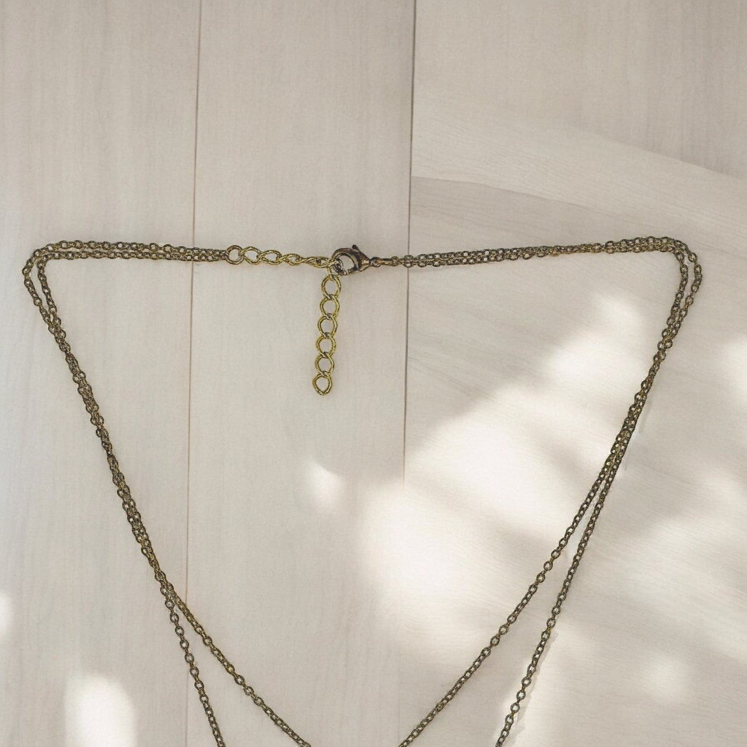 Big Blue by Roland St John layered bronze necklace with sea turtle pendants, boho coastal style.