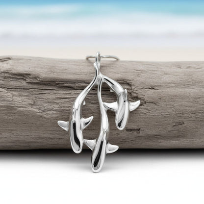 Big Blue by Roland St John sterling silver triple grey reef shark pendant necklace, inspired by underwater motion.