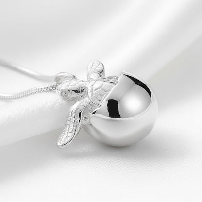 Big Blue by Roland St John sterling silver baby sea turtle hatchling necklace, symbolizing hope and resilience.