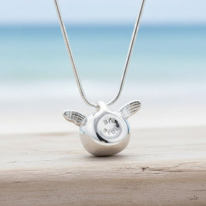 Big Blue by Roland St John sterling silver baby sea turtle hatchling necklace, symbolizing hope and resilience. Detailed pendant on a snake chain.