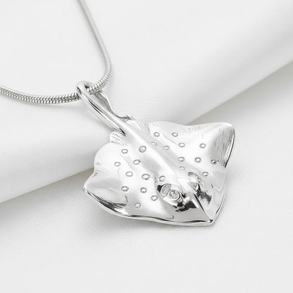 Big Blue by Roland St John sterling silver stingray pendant necklace with detailed markings and a small diamond eye, on a snake chain.
