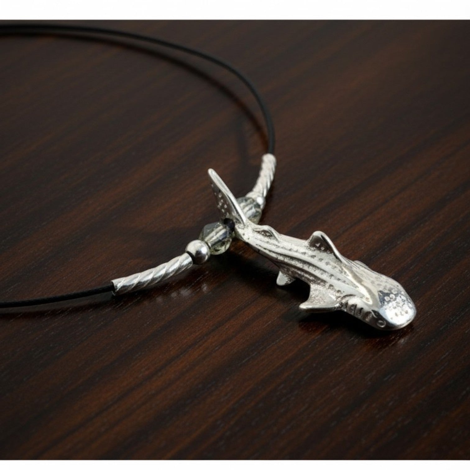 Big Blue by Roland St John sterling silver whale shark pendant choker necklace on black cable wire with silver accents.