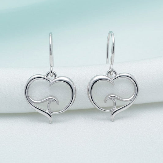 Big Blue by Roland St John sterling silver heart drop earrings with a wave design inside the heart.