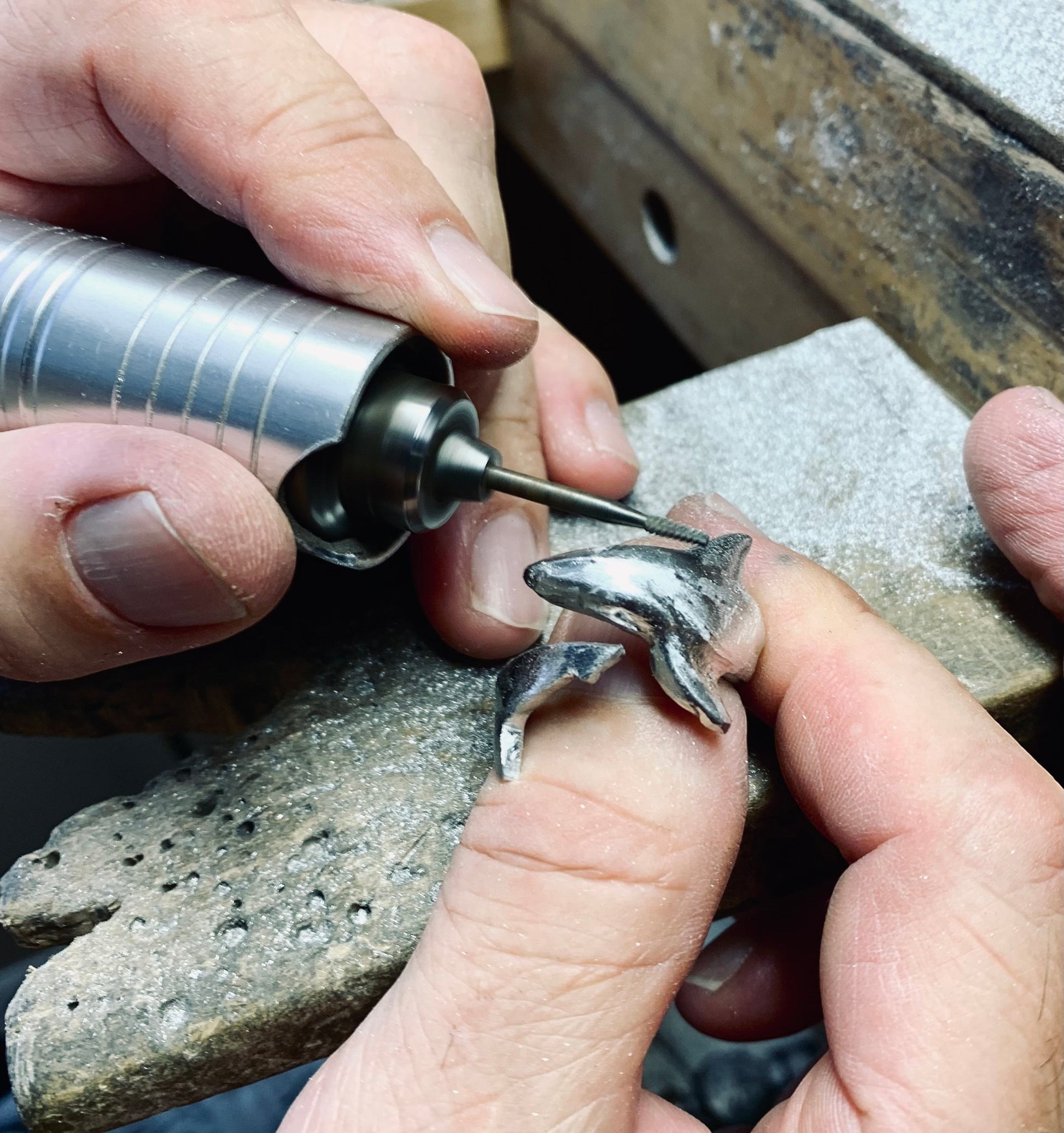 Big Blue by Roland St John handcrafted sterling silver adjustable shark ring being detailed with a rotary tool.