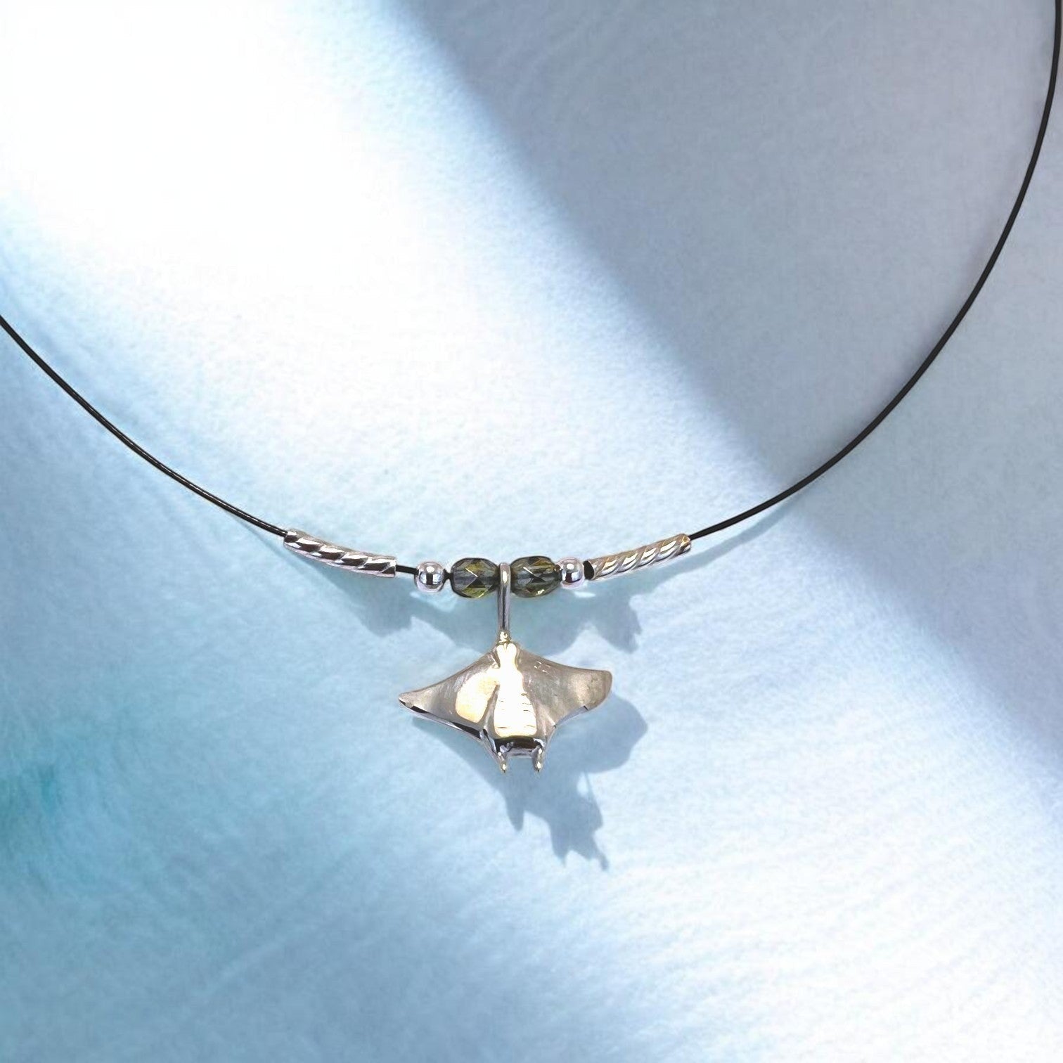 Big Blue by Roland St John sterling silver miniature manta ray choker necklace with green beads and silver accents.