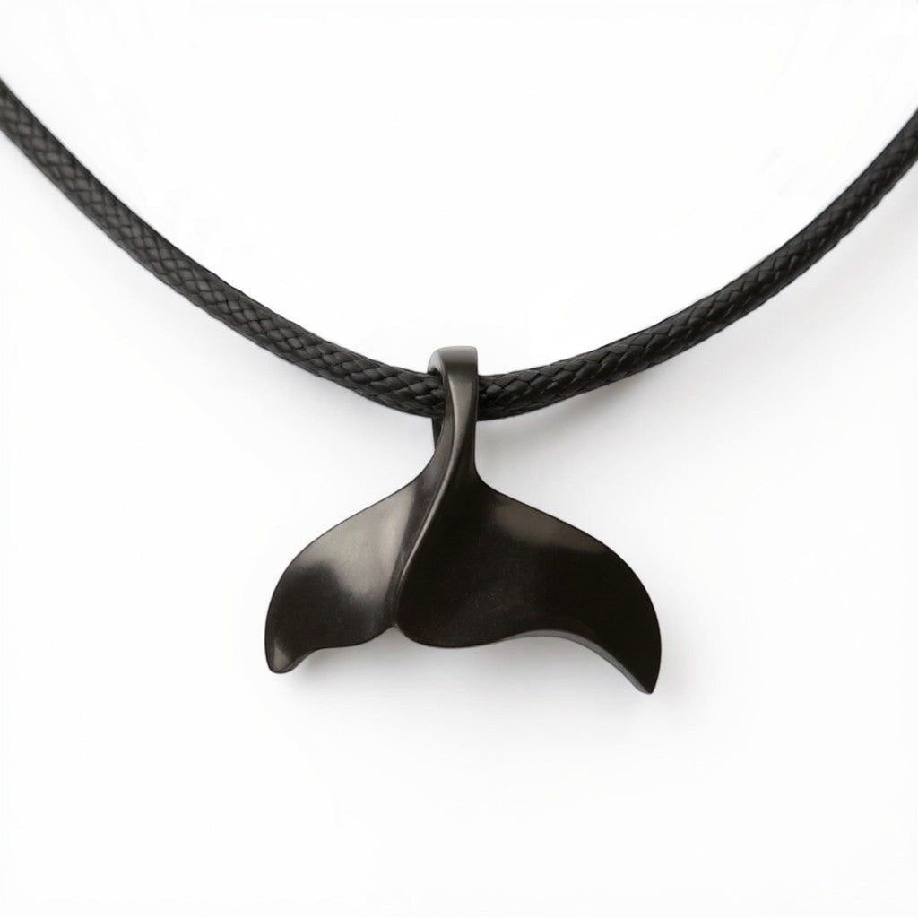 Big Blue by Roland St John black whale tail pendant on a black cord necklace, inspired by the ocean.