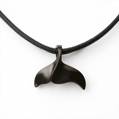 Big Blue by Roland St John black whale tail pendant on a black cord necklace, inspired by the ocean.