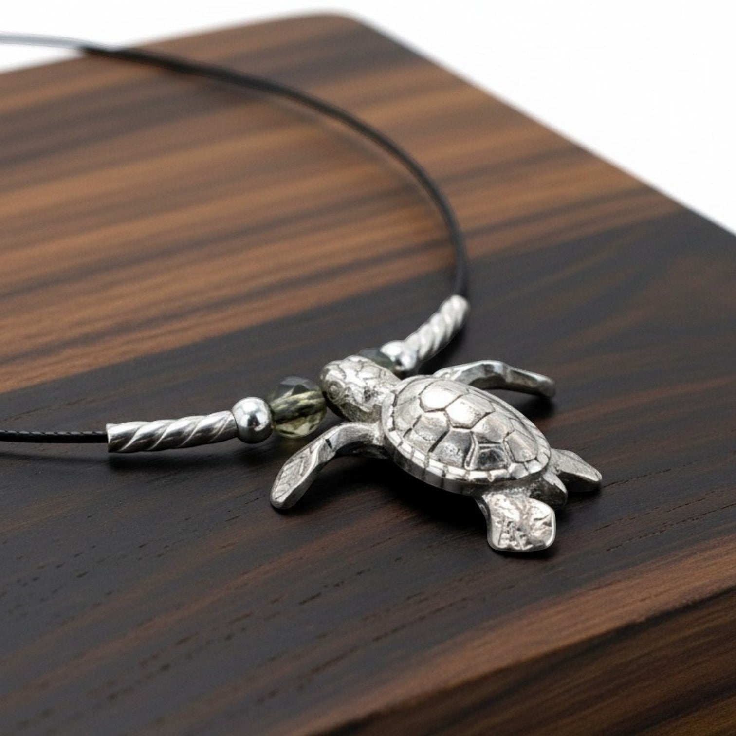 Big Blue by Roland St John sterling silver sea turtle choker necklace with a realistic 3D design on a black cable wire.