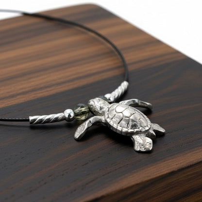 Big Blue by Roland St John sterling silver sea turtle choker necklace with a realistic 3D design on a black cable wire.
