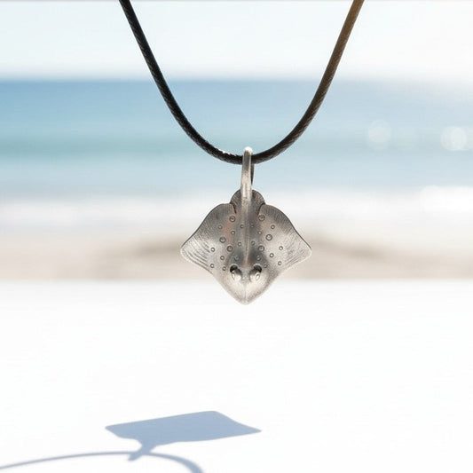Big Blue by Roland St John pewter stingray pendant necklace with black cord, detailed gills and textured finish.