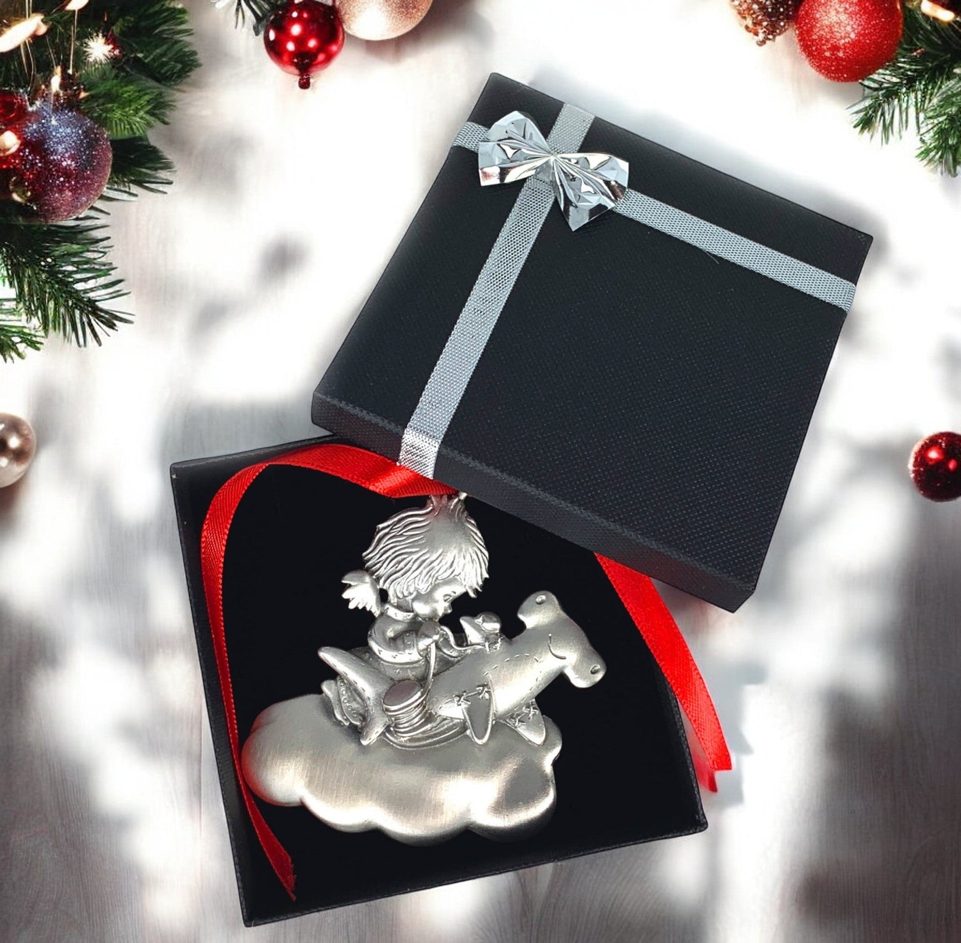 Big Blue by Roland St John pewter Christmas ornament of an angel riding an octopus on a cloud, part of the Ocean Angel Collection.