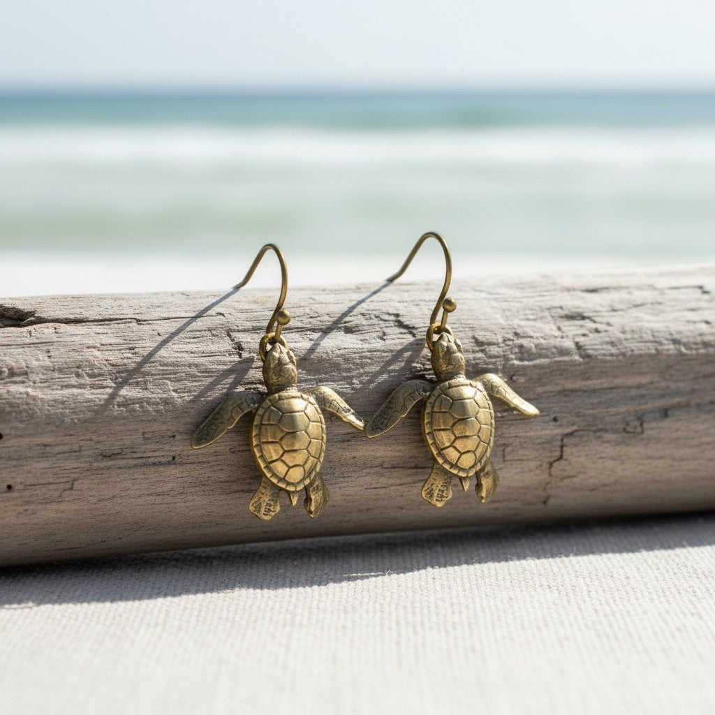 Big Blue by Roland St John bronze baby sea turtle drop earrings, detailed hatchling design, beach-themed.