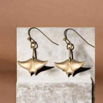 Big Blue by Roland St John bronze manta ray drop earrings, part of the Sealife Collection. Sculpted in bronze with a warm, earthy tone.