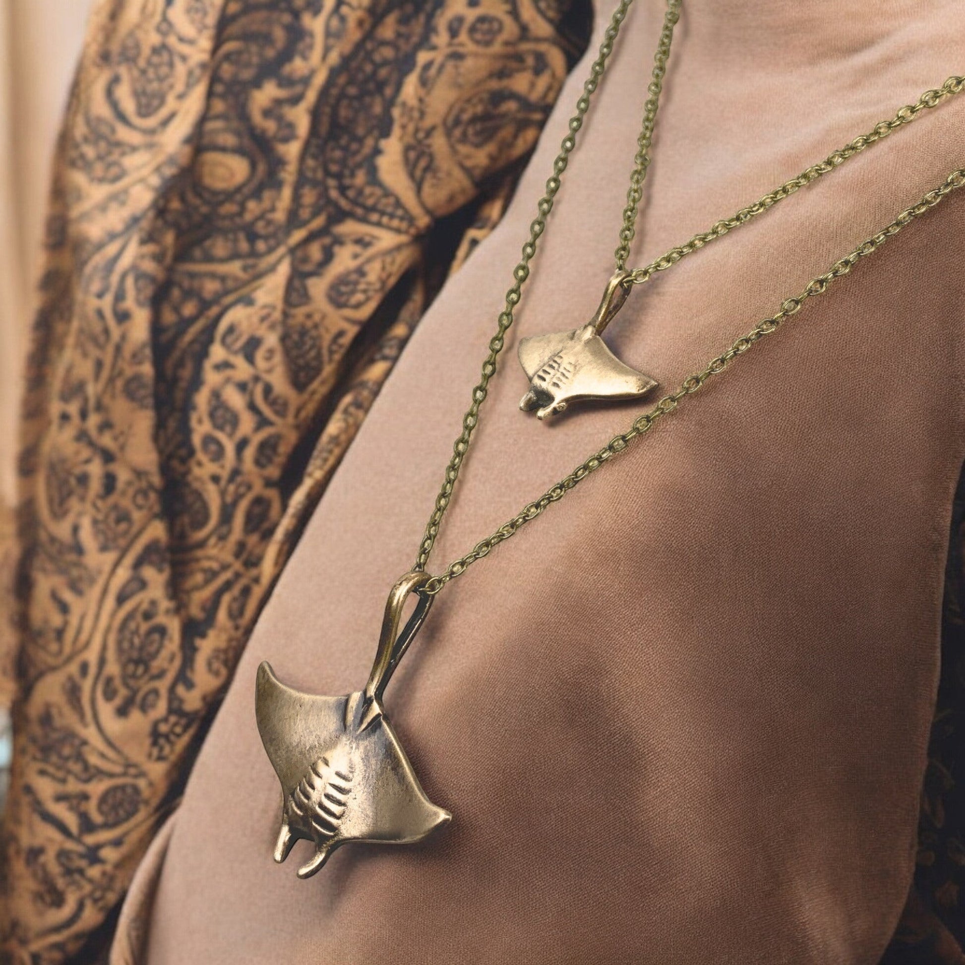 Big Blue by Roland St John layered bronze necklace with two manta ray pendants, boho beach style.