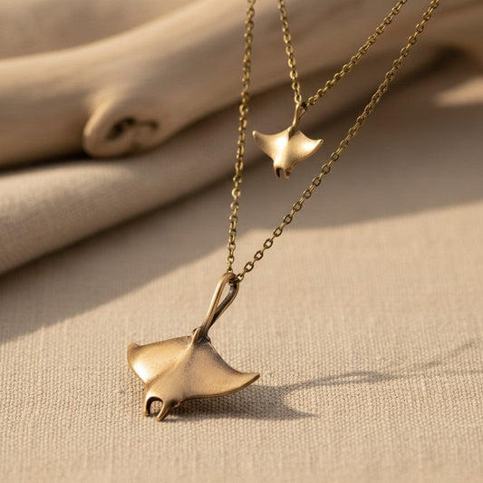 Big Blue by Roland St John layered bronze necklace with two manta ray pendants. Boho beach jewelry.