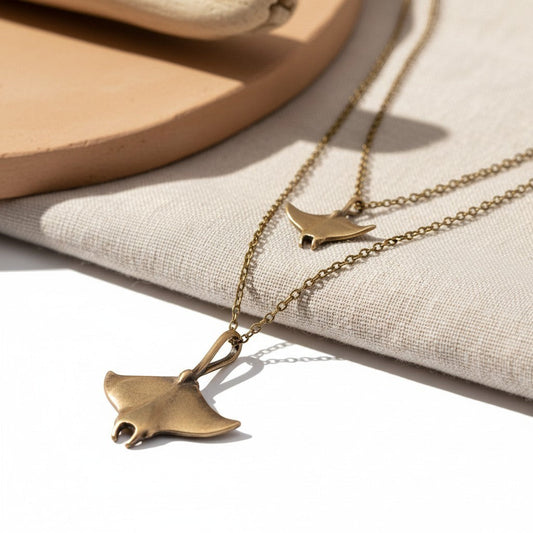 Big Blue by Roland St John layered bronze necklace with two manta ray pendants, boho beach jewelry.