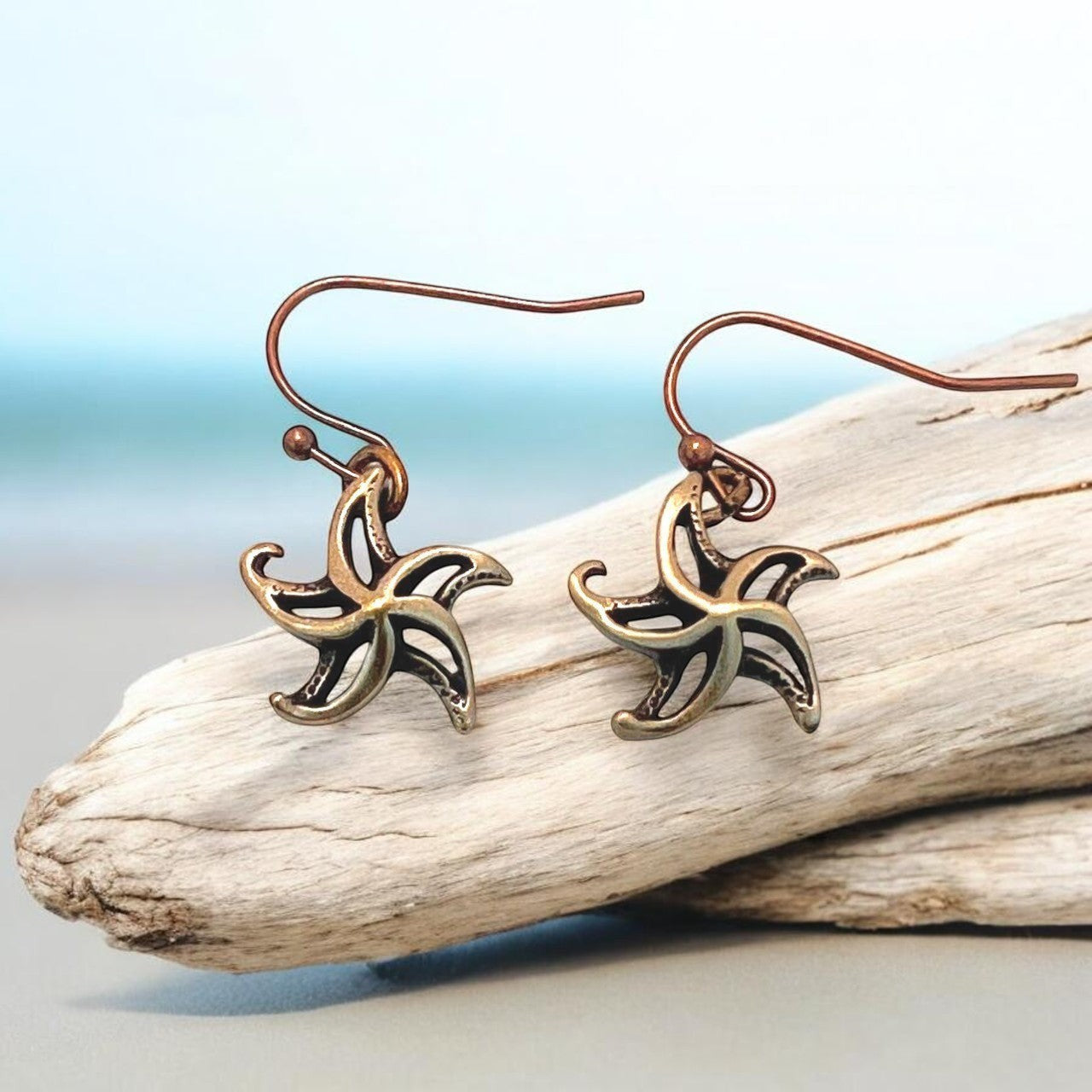 Big Blue by Roland St John bronze starfish drop earrings with a contemporary boho design, perfect for beach lovers.