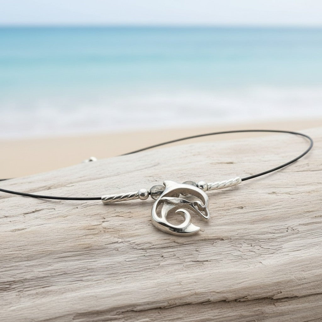 Big Blue by Roland St John sterling silver dolphin choker necklace with miniature pendant and black cord.