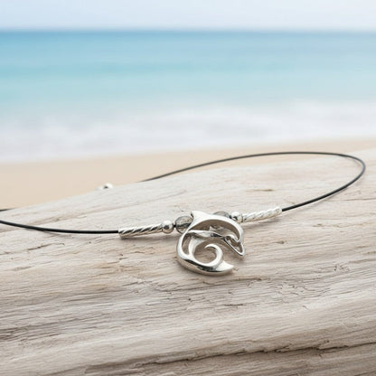 Big Blue by Roland St John sterling silver dolphin choker necklace with miniature pendant and black cord.