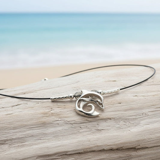 Big Blue by Roland St John sterling silver dolphin choker necklace with miniature pendant and black cord.