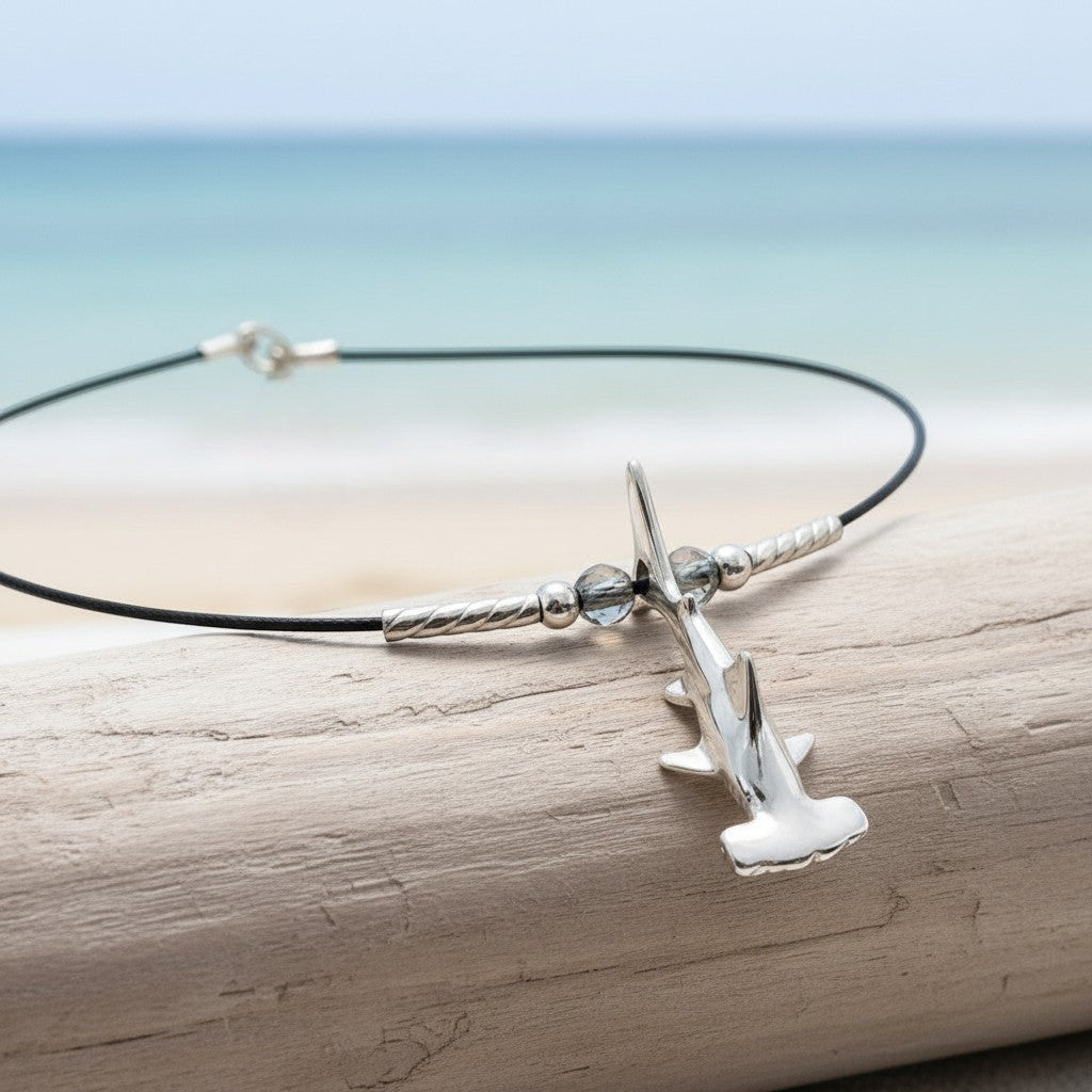 Big Blue by Roland St John sterling silver hammerhead shark choker necklace with beaded accents on cable wire.
