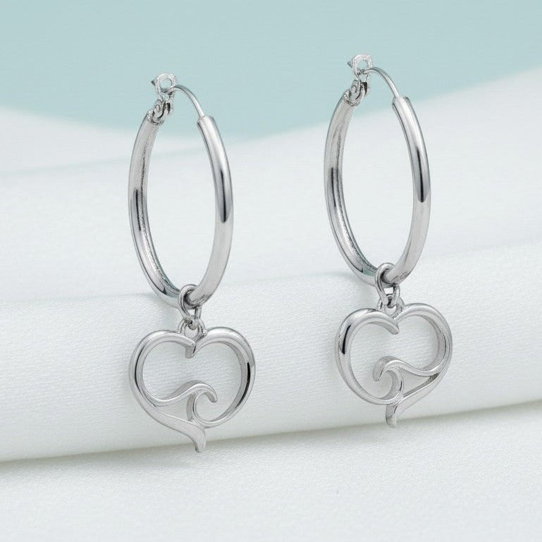 Big Blue by Roland St John sterling silver hoop earrings with a heart and ocean wave charm. Hypoallergenic and lead-free.