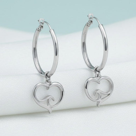 Big Blue by Roland St John sterling silver hoop earrings with a heart and ocean wave charm. Hypoallergenic and lead-free.