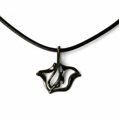 Big Blue by Roland St John jet black finish stingray pendant necklace on black cord.