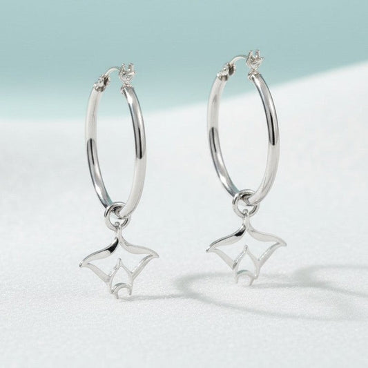 Big Blue by Roland St John sterling silver hoop earrings with detailed manta ray charms. Polished finish, 1.5" long.