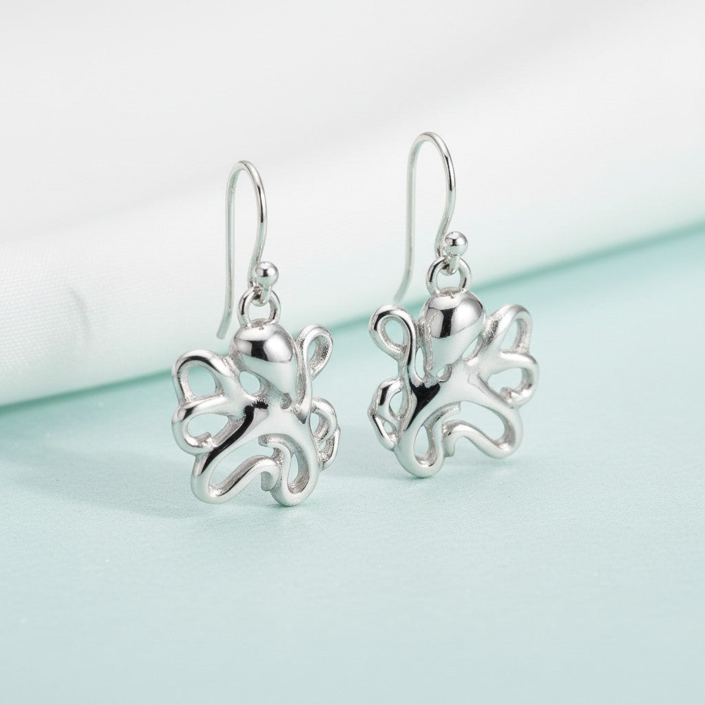 Big Blue by Roland St John sterling silver octopus drop earrings with intricate tentacle details. Ocean-inspired jewelry.