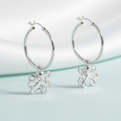 Big Blue by Roland St John sterling silver hoop earrings with dangling octopus charms. Hypoallergenic and nickel-free.