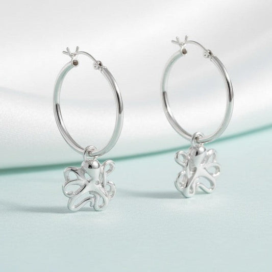 Big Blue by Roland St John sterling silver hoop earrings with dangling octopus charms. Hypoallergenic and nickel-free.