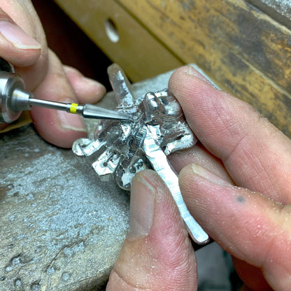 Big Blue by Roland St John sterling silver octopus ring being detailed with a rotary tool. Adjustable, lifelike tentacles.