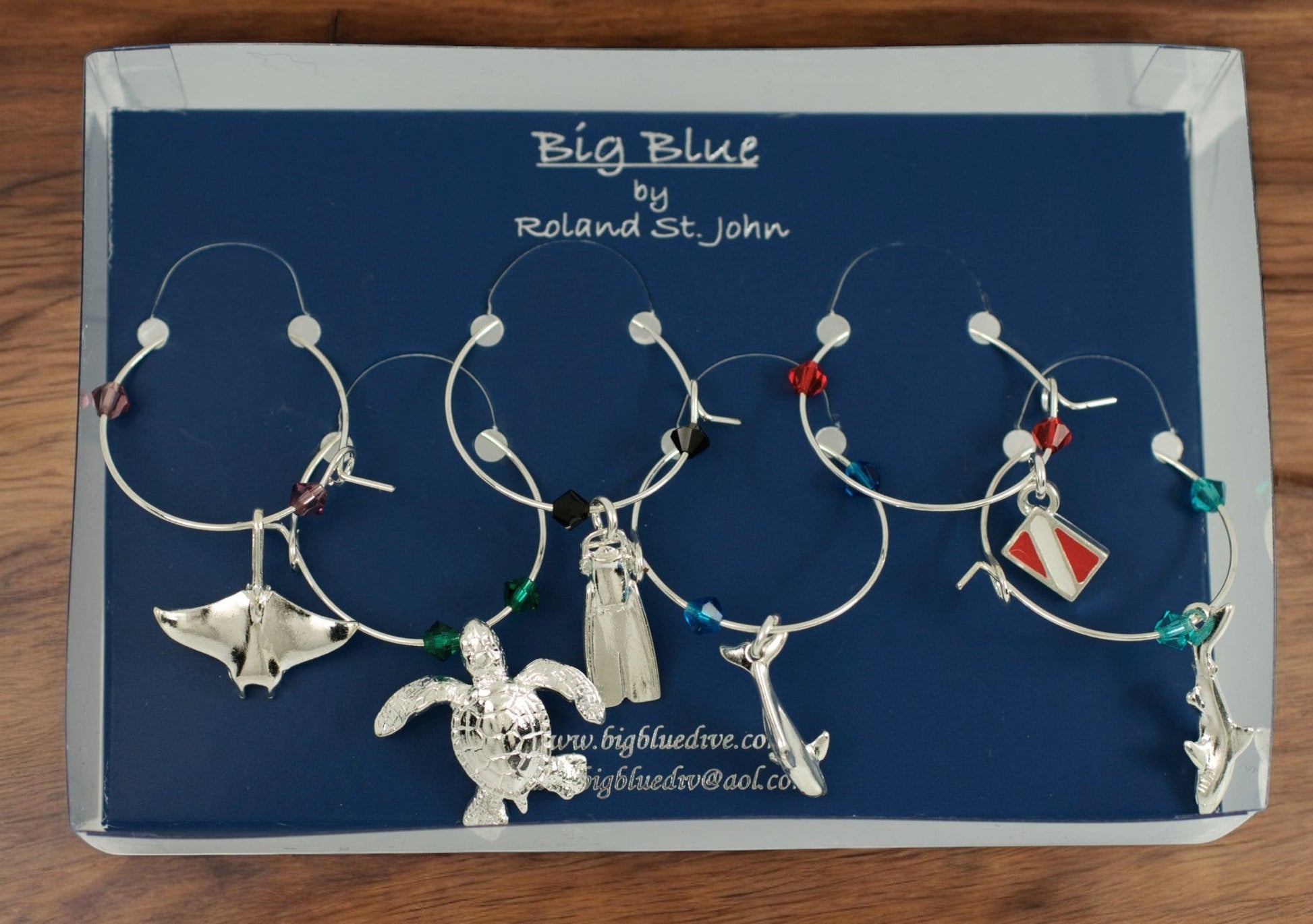 Big Blue by Roland St John set of 6 silver wine glass charms with sea life and scuba diving themes, including a turtle, manta ray, shark, dolphin, dive fin, and dive flag, accented with colorful beads.