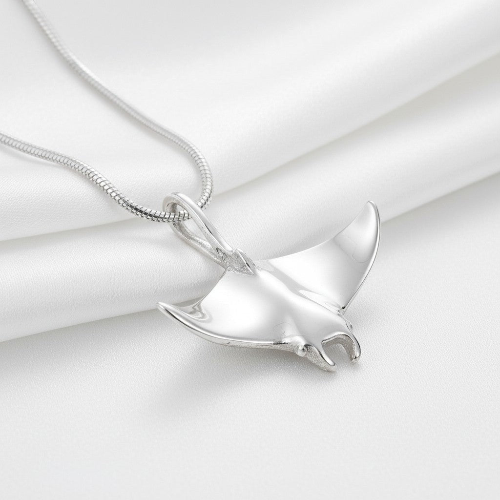 Big Blue by Roland St John realistic sterling silver manta ray necklace with detailed wings and body, on a snake chain.