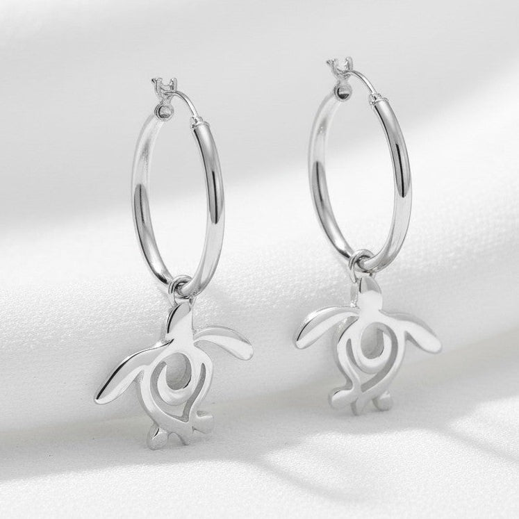 Big Blue by Roland St John sterling silver hoop earrings with dangling sea turtle charms. Ocean-inspired jewelry.