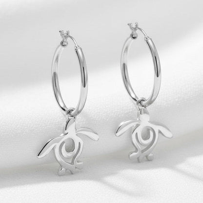 Big Blue by Roland St John sterling silver hoop earrings with dangling sea turtle charms. Ocean-inspired jewelry.