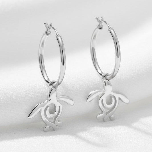 Big Blue by Roland St John sterling silver hoop earrings with dangling sea turtle charms. Ocean-inspired jewelry.
