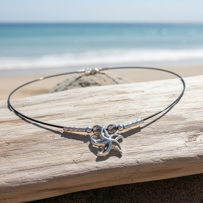 Big Blue by Roland St John sterling silver choker necklace with a mini 3D starfish pendant and grey beads, on a beach setting.
