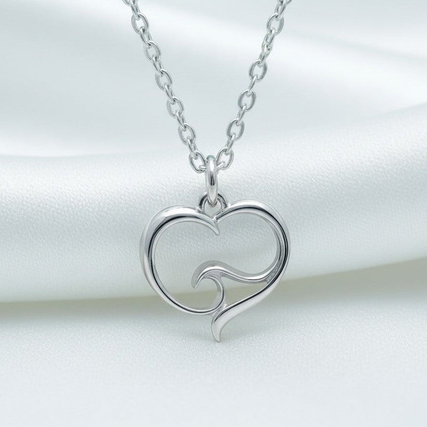 Big Blue by Roland St John sterling silver heart necklace with wave detail. Delicate, hypoallergenic, and handcrafted.