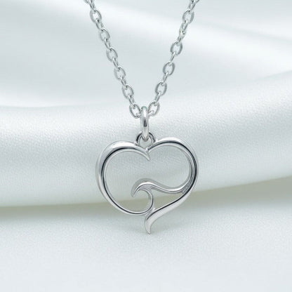 Big Blue by Roland St John sterling silver heart necklace with wave detail. Delicate, hypoallergenic, and handcrafted.