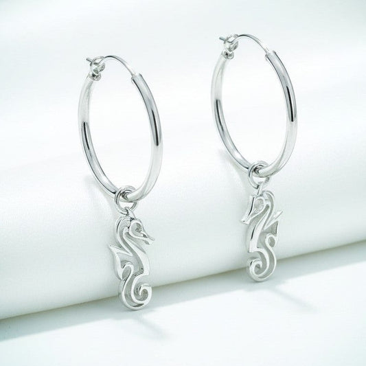 Big Blue by Roland St John sterling silver hoop earrings with dangling seahorse charms. Modern ocean-inspired design.