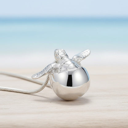 Big Blue by Roland St John sterling silver baby sea turtle hatchling necklace, symbolizing hope and resilience.