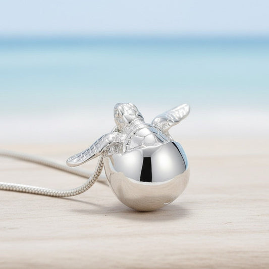 Big Blue by Roland St John sterling silver baby sea turtle hatchling necklace, symbolizing hope and resilience.
